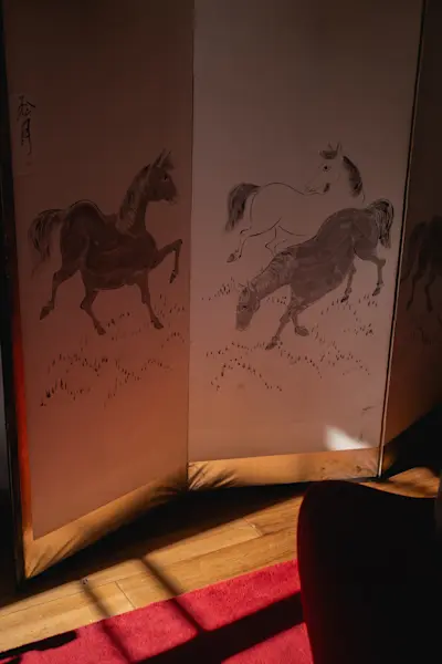 Japanese Byobu screen with hand painted horses, silver leaf and black lacquer edge.