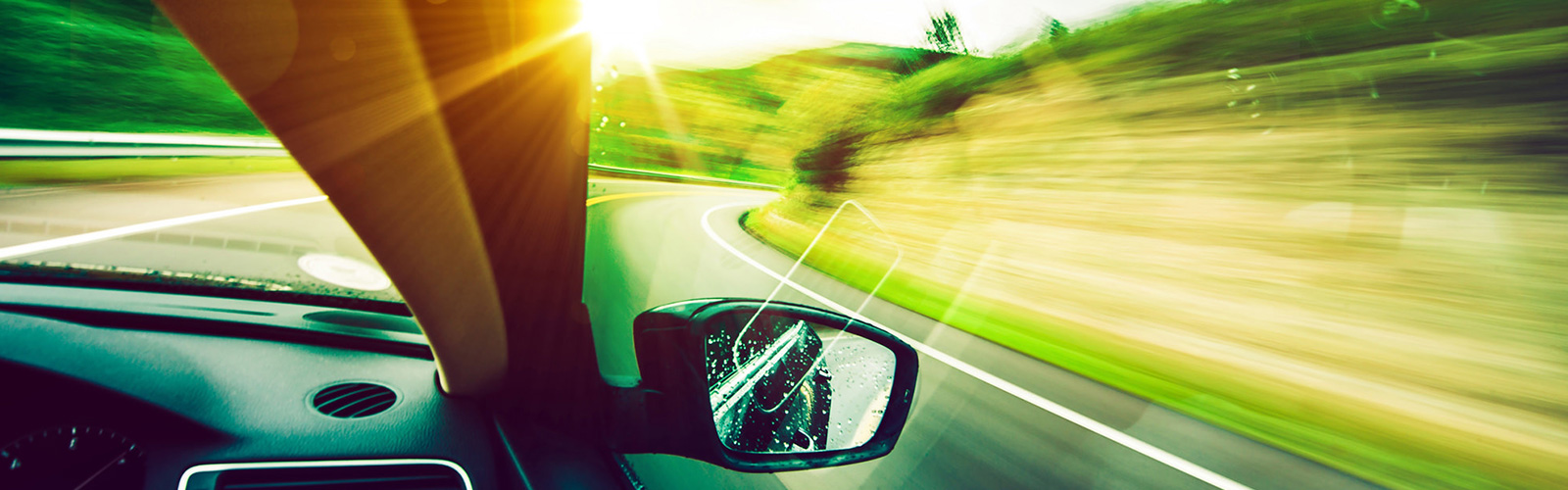 Looking outside the window of a car going around a corner at high speed