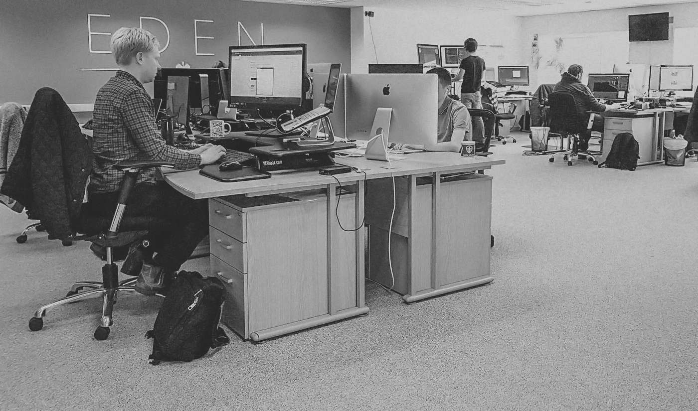 People working at their desks in the Eden Agency office