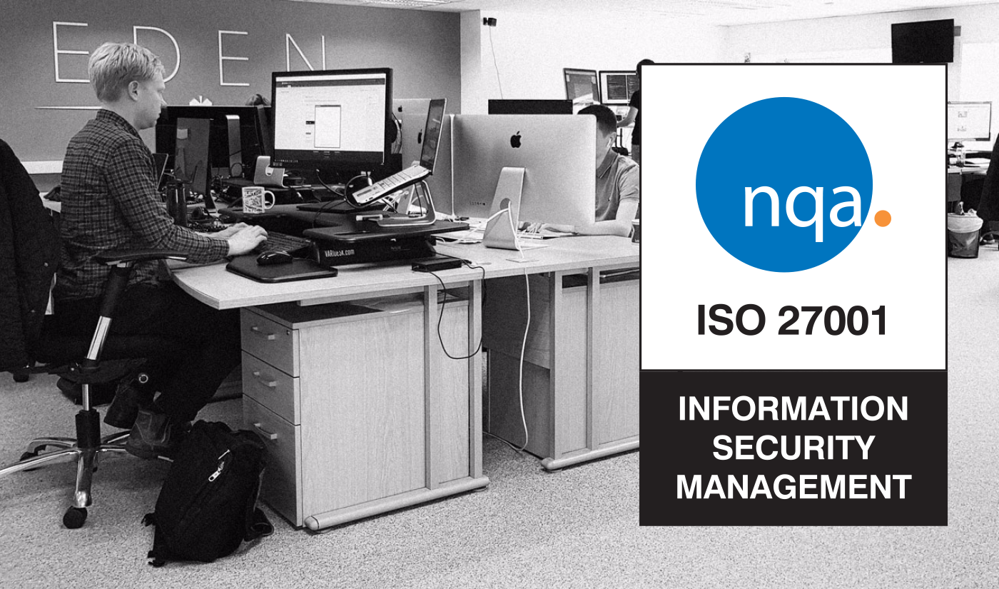 Eden Agency staff sat at their desks working, with the NQA ISO 27001 badge superimposed.