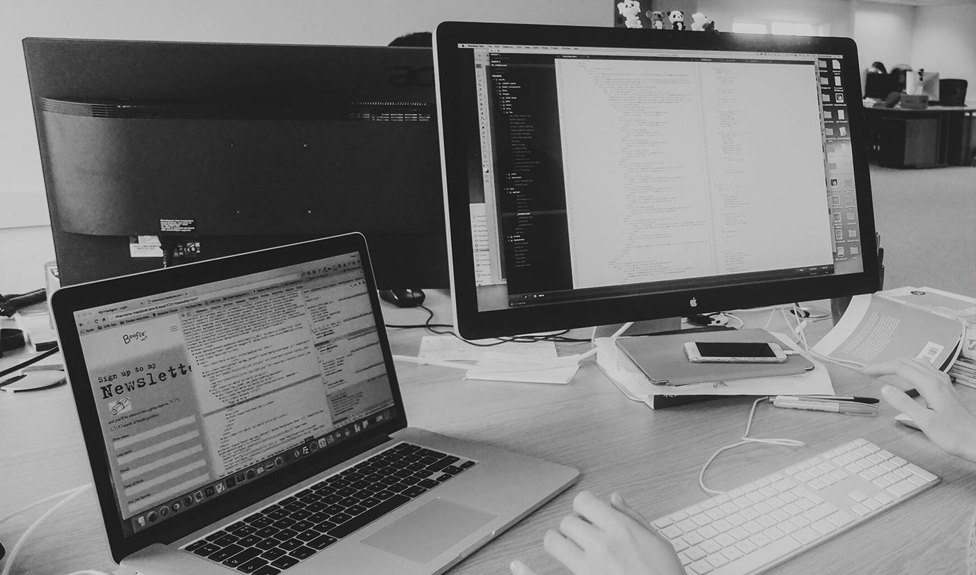 A person sat at their desk doing web development