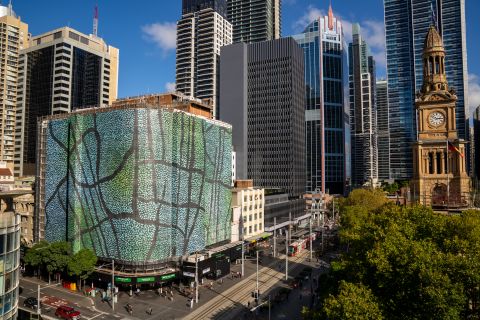 Woolworths building with artwork by Toby Bishop next to Sydney Town Hall