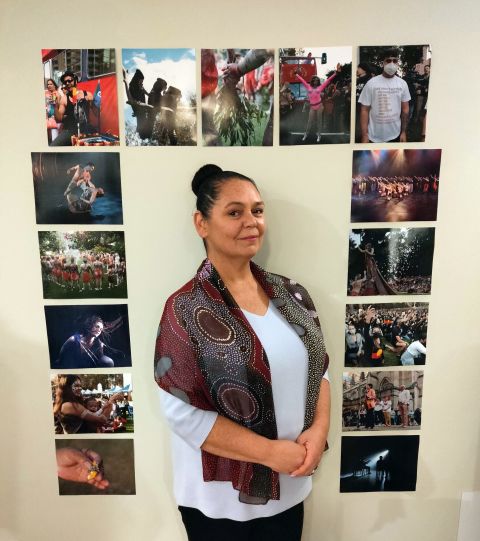 Artist Michelle Blakeney with images of various community events. Photo: Michelle Blakeney