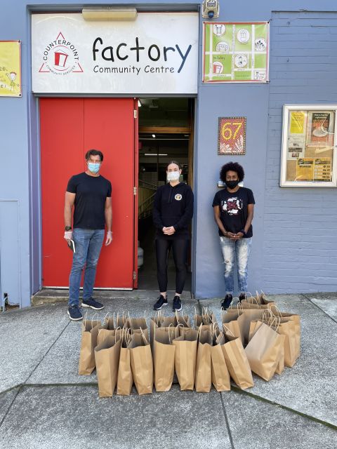 Alasdair Grant from Viral Kindness with Coral Lever and Elley Meadows from First Nations Covid-19 Response distribute hampers from the Factory Community Centre in Waterloo
