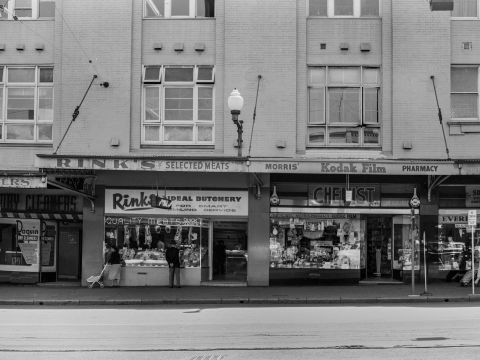 Rinks Ideal Butchery, pictured here in the 1960s, is one of the historical Oxford Street businesses that appear in the mural. Photo: City of Sydney Archives A-00044078