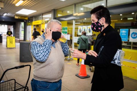 Lord Mayor Clover Moore distributing free face masks.
