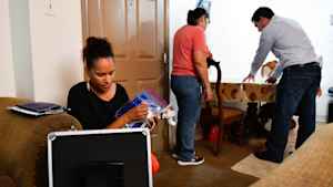 A CU student and researcher enter the home of a study particpant and begin to ask her questions about her family's experience with episodes of asthma.