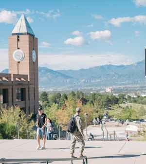 Students, many of whom include active military and veterans, walk across the UCCS campus in Colorado Springs.