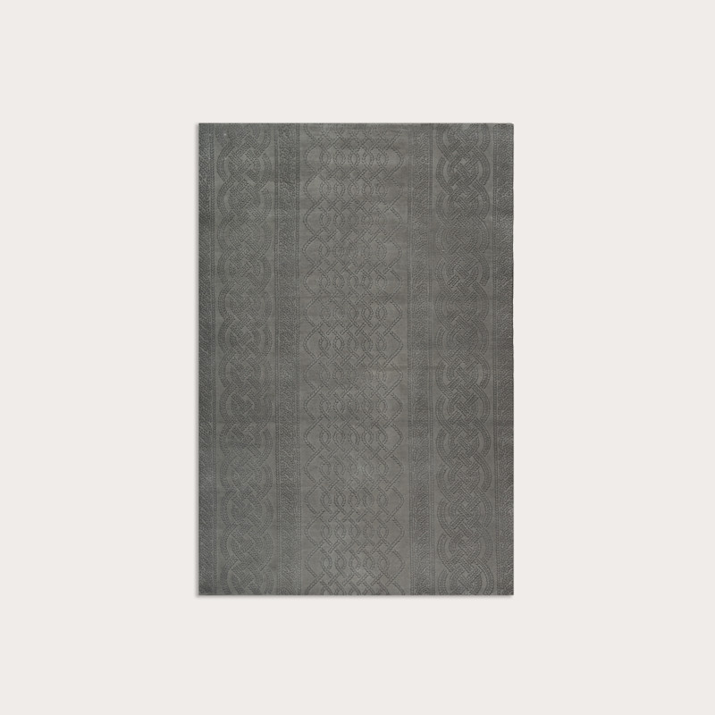 In studio photograph of Cable Knit Grey