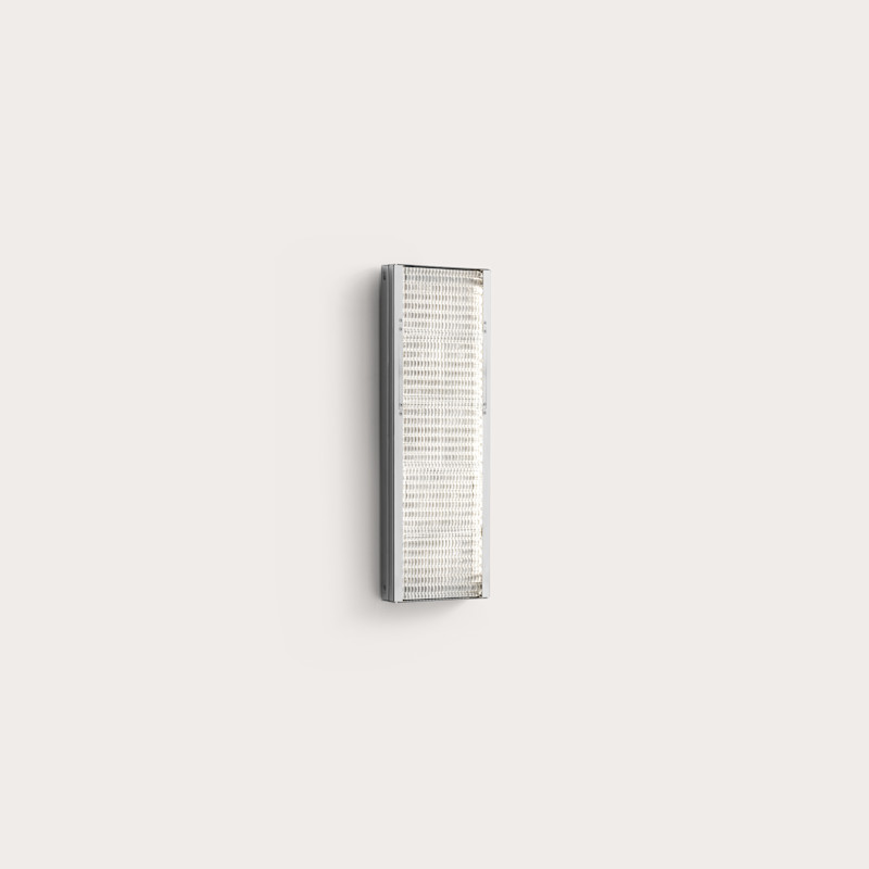 In studio photograph of Sistema Applique Wall Lamp