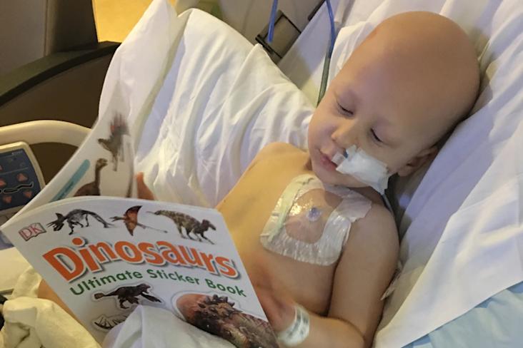 6 year old starlight kid luke in a hospital bed wired up