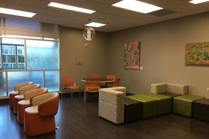 Previous empty Teen Room with some chair and a table at Dell Children's Medical Center
