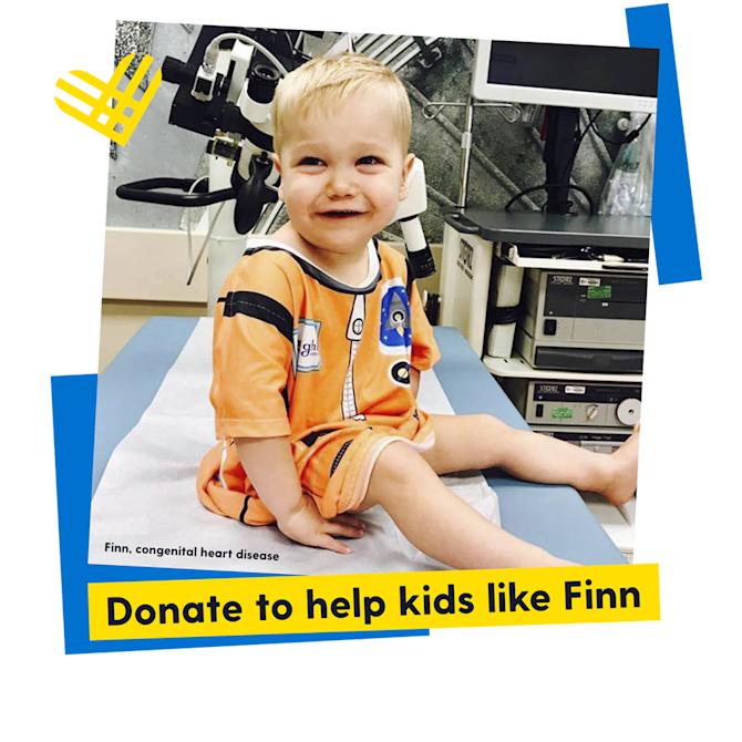 Finn, diagnosed with congenital heart disease, sitting in the hospital in his starlight gown, donate to help kids like Finn