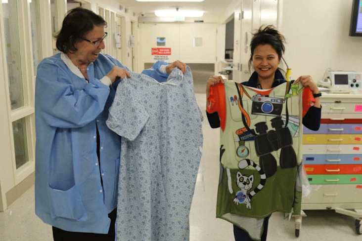 NURSES AT DIGNITY HEALTH – NORTHRIDGE HOSPITAL MEDICAL CENTER COMPARE A TYPICAL HOSPITAL GOWN TO A COLORFUL STARLIGHT GOWN.
