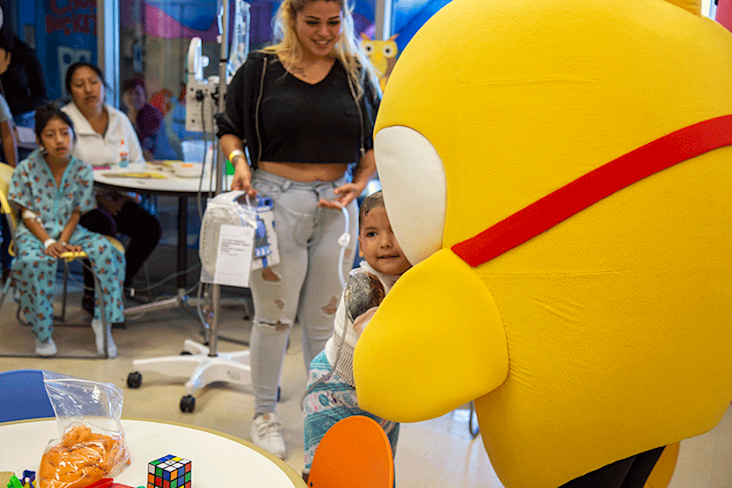 kid in pediatric unit hugging Baby Shark