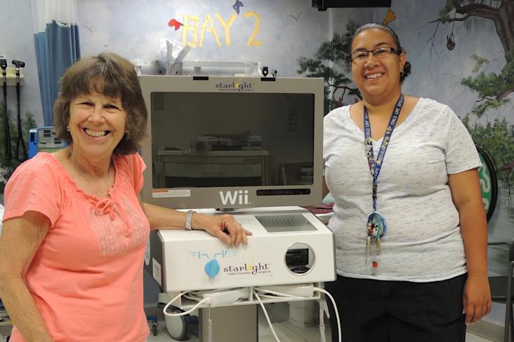 Jo Anne on left in Childrens Hospital of New Mexico with a Starlight Wii Gaming Station
