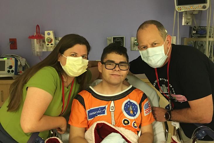 Starlight kid luke in the hospital with his family