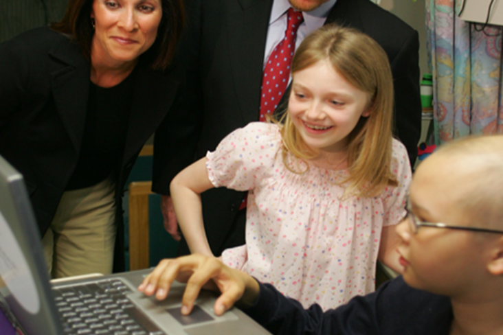 Actress Dakota Fanning visiting a seriously ill kid in the hospital (2006).