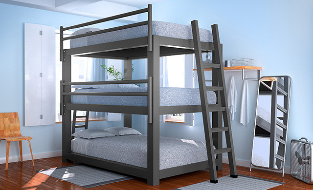 A charcoal Full XL Triple Bunk Bed in a hostel