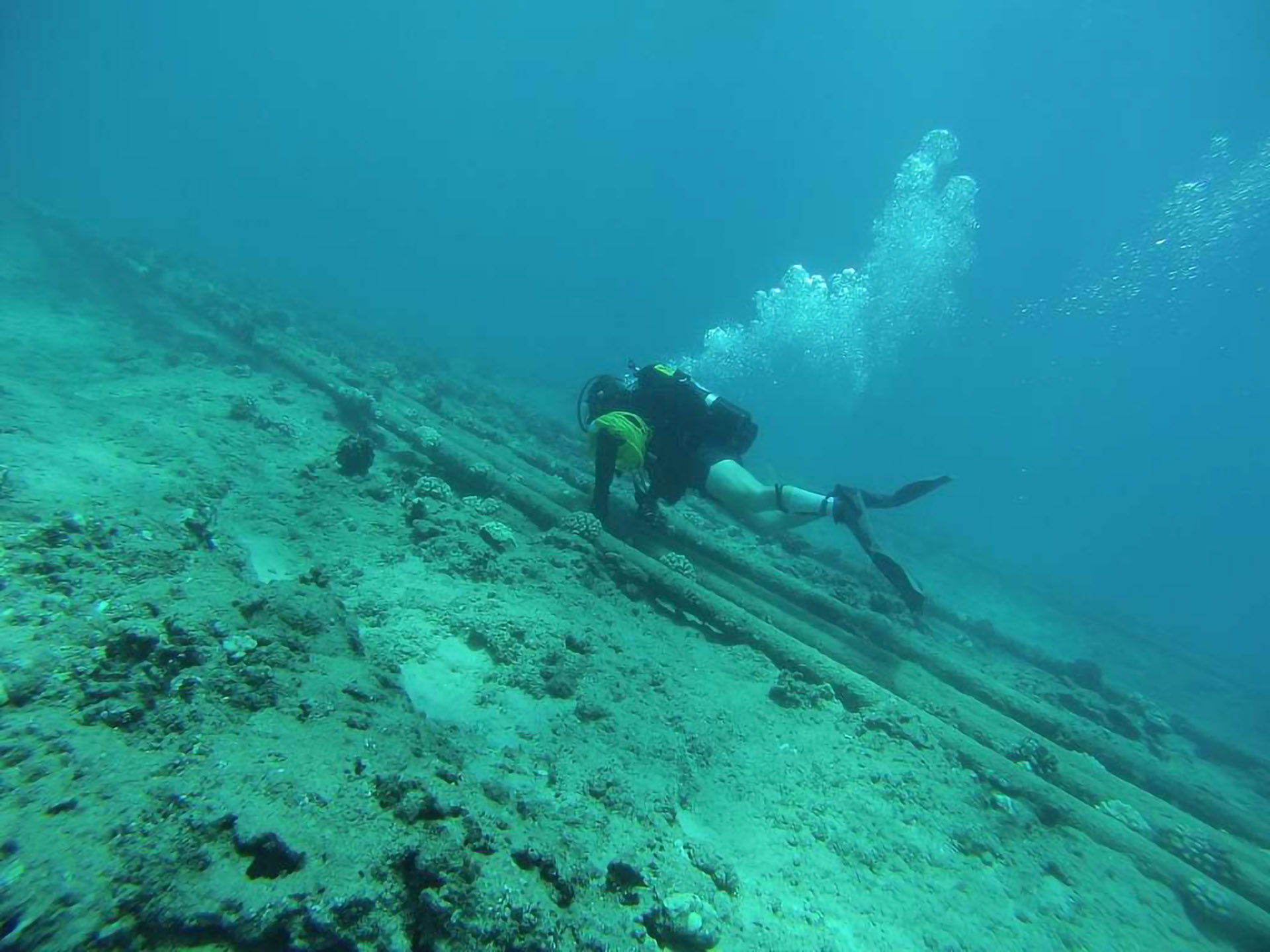 Diver inspecting cables
