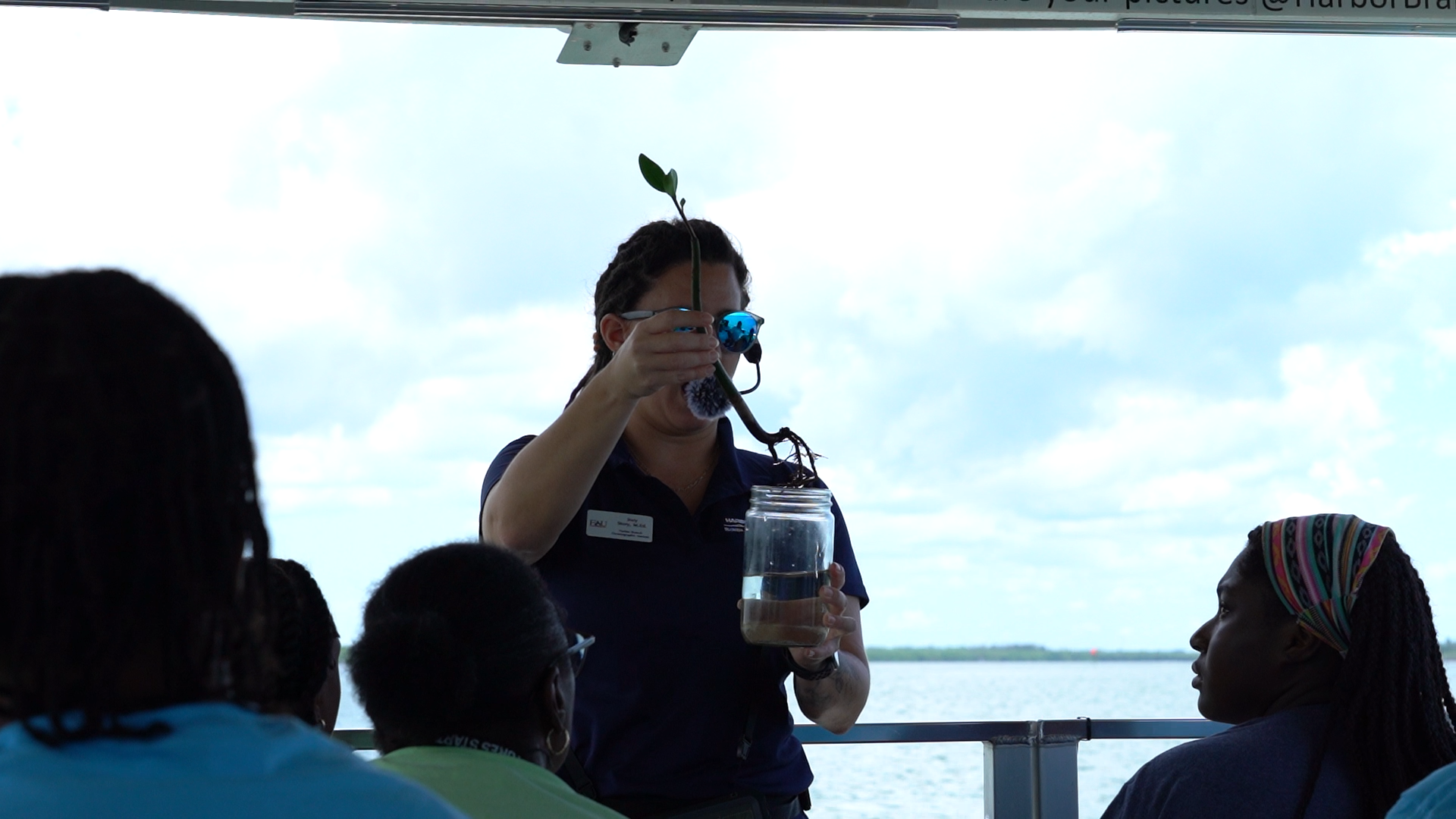 marine scientist holding sample or specimen