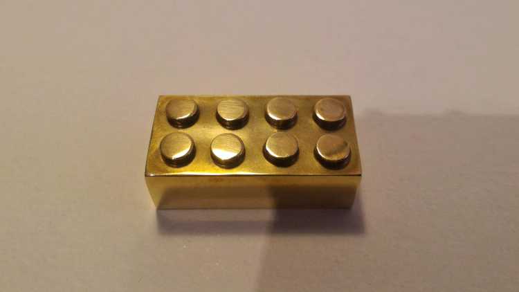 Expensive Useless Things Solid gold lego brick