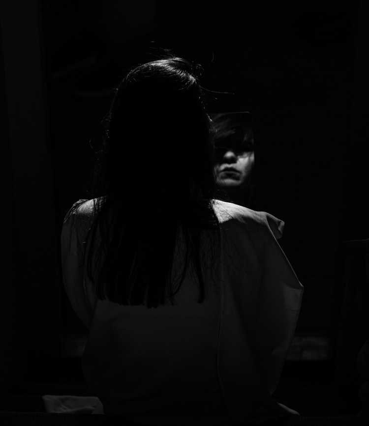 woman reflection dark shadow mirror