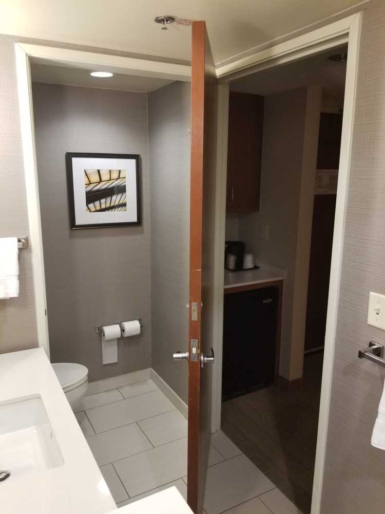 Radical Restroom door can be slotted into both frames