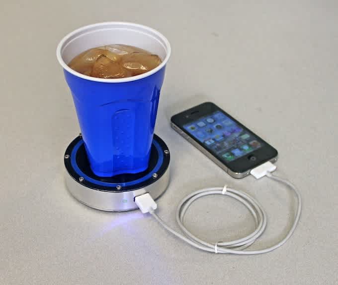 Epiphany One Puck phone charger with hot or cold drinks
