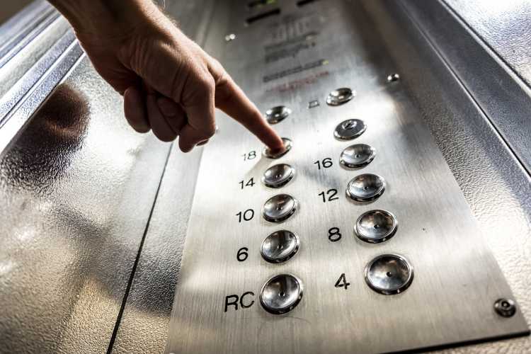 Elevator lift pressing button