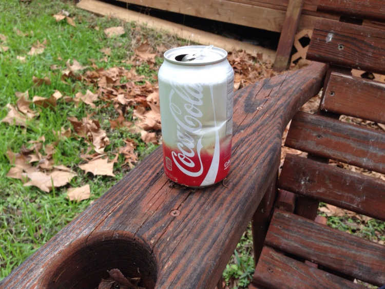 Faded Coke soda Can photodegradation cup holder