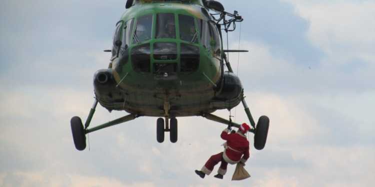 North Macedonia military Santa hanging from helicopter