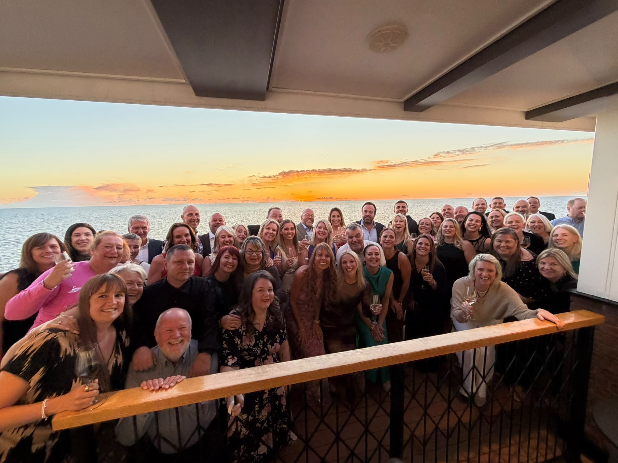 Alaska Group Shot Deck at Sunset