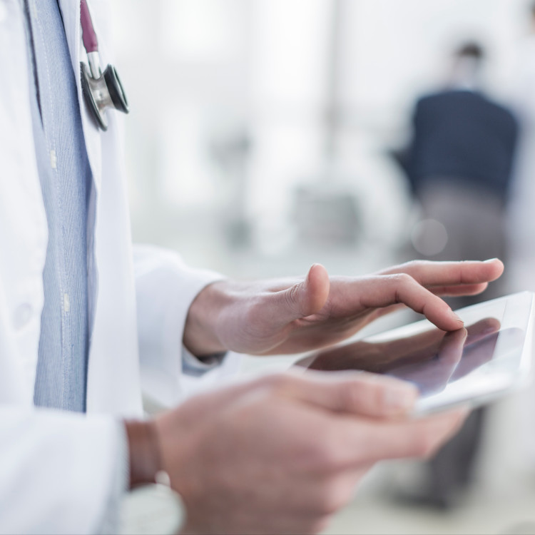 Doctor using tablet