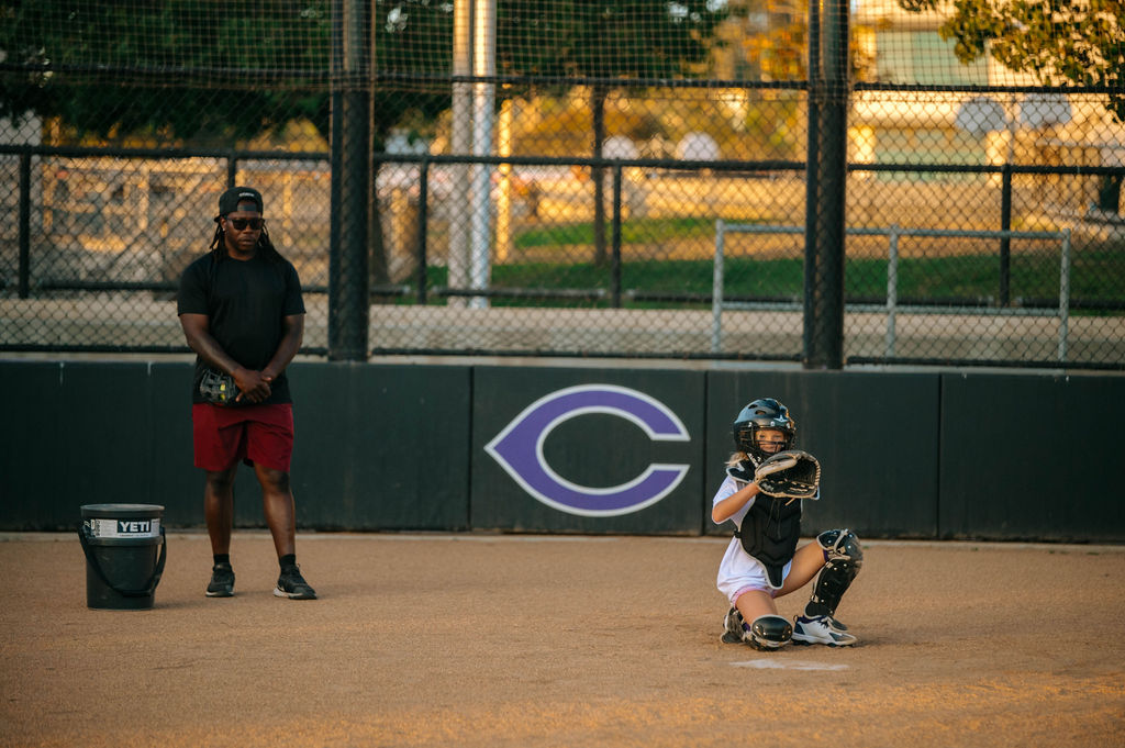 Girl Catching with coach watching