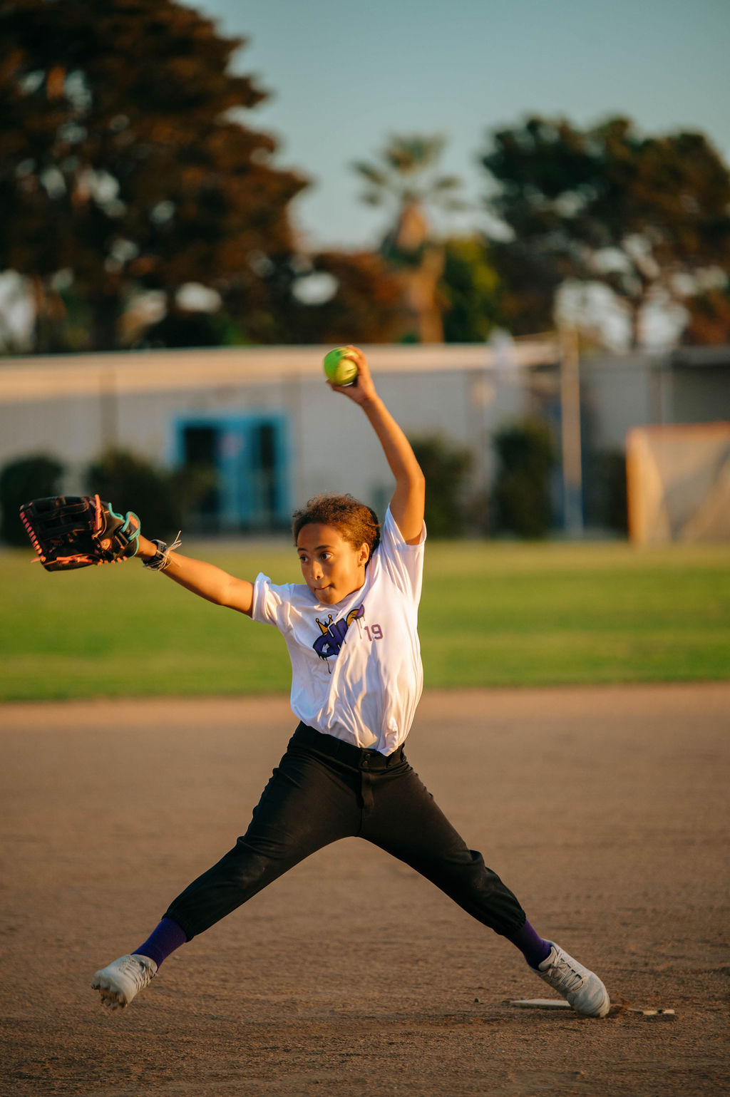 Girl pitching the ball