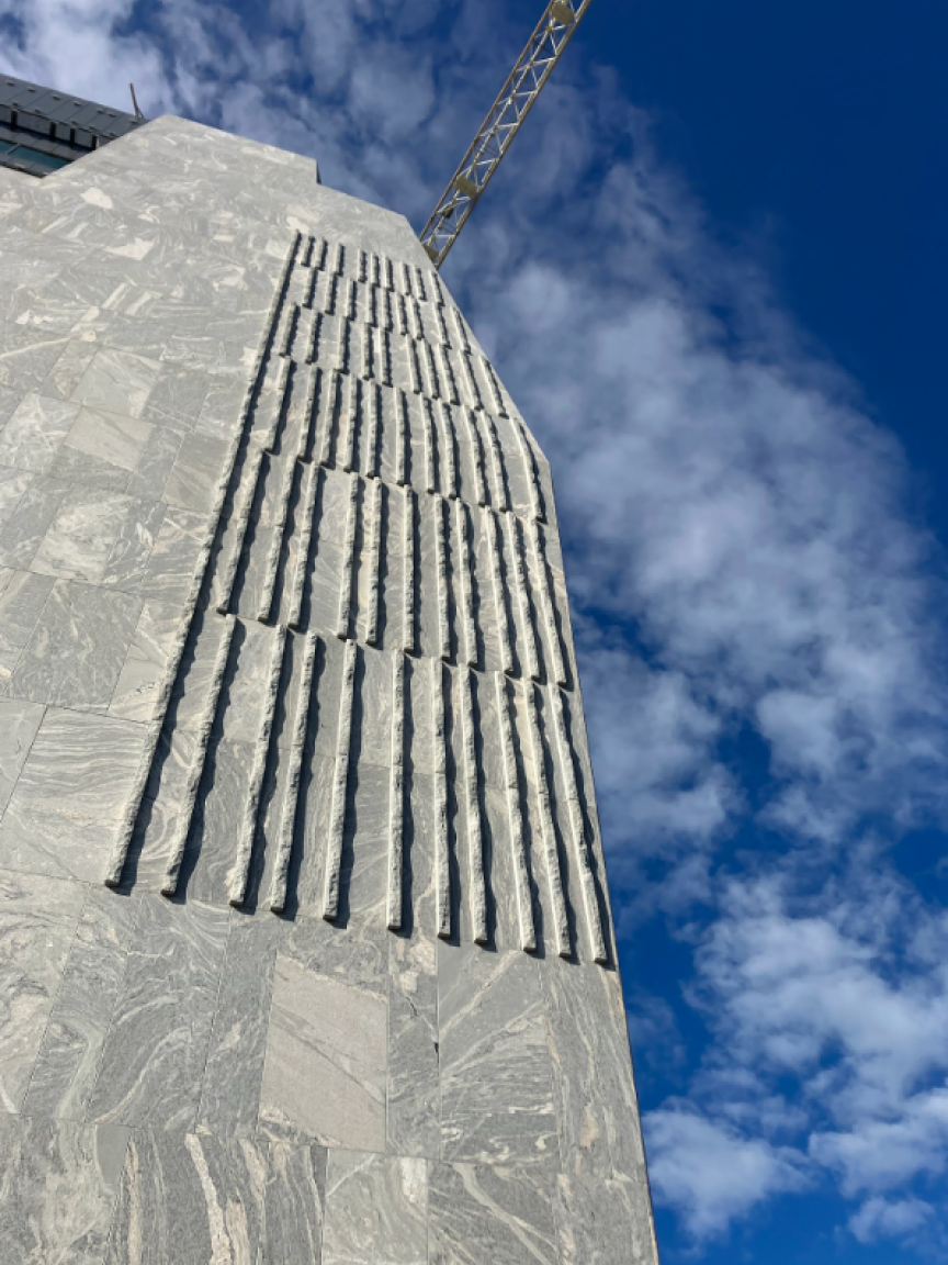 A photograph at the exterior design of the Obama Presidential Center Museum. In the background is blue sky.