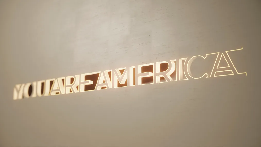 "You are America" is shown in the design of how it will appear on the Obama Presidential Center Museum, and it glows. building. 