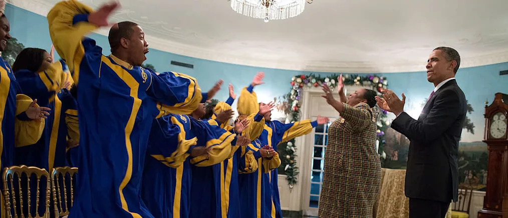 President Barack Obama listens to the Crenshaw Elite Choir