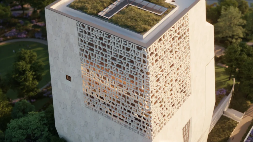 A overhead image of the future Obama Presidential Musem Building. A cream color brick with words craved inside of the walls and small plot of grass on top 