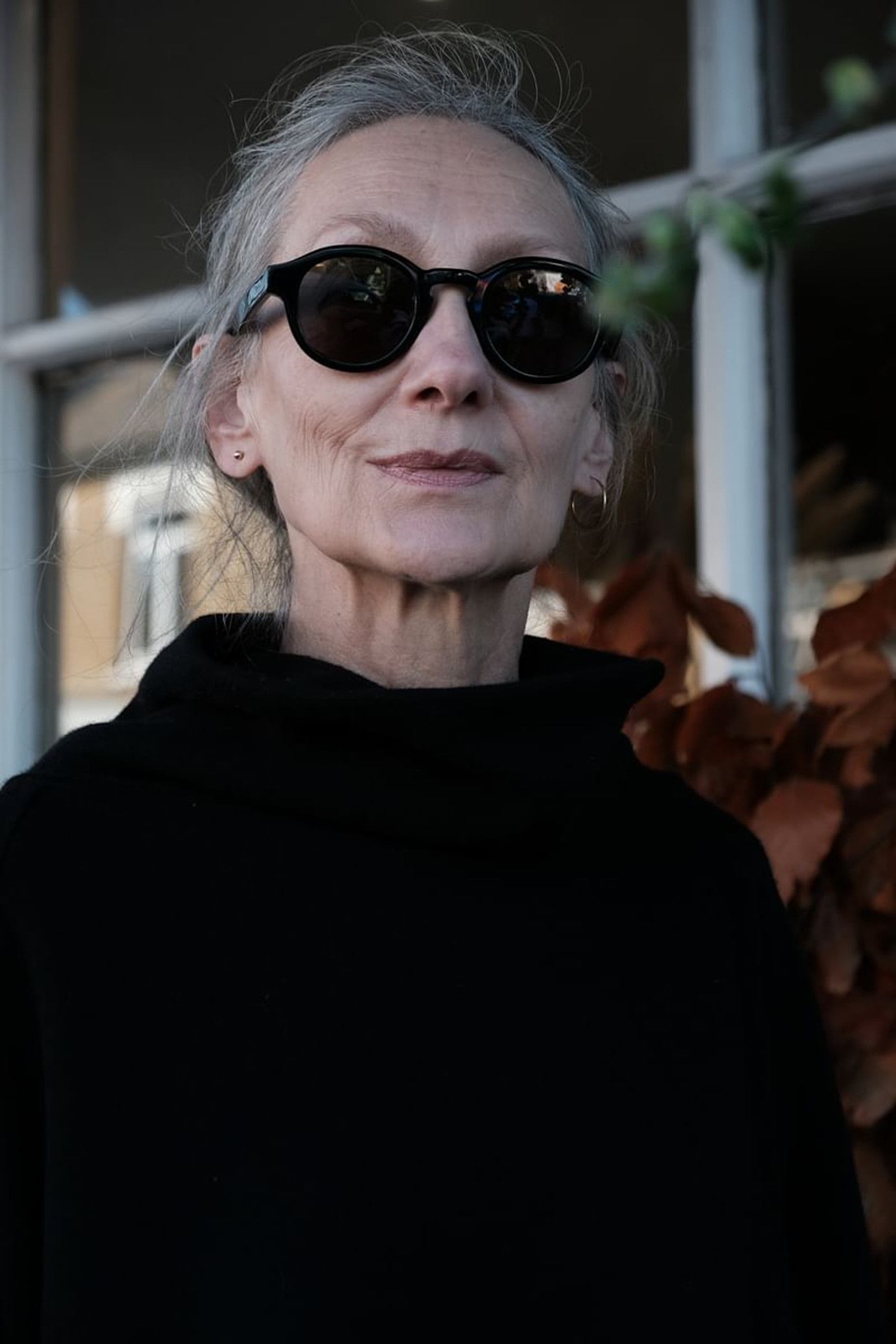 Senior female model with sunglasses at Contact SANNA KELLY