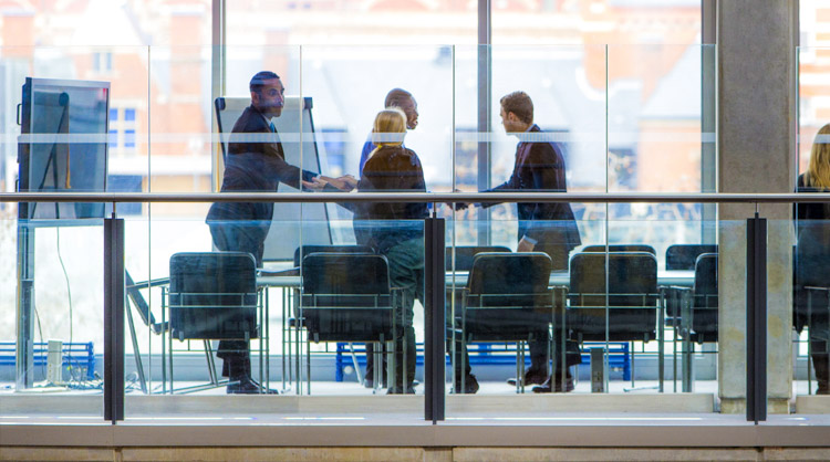 People meeting in conference room.