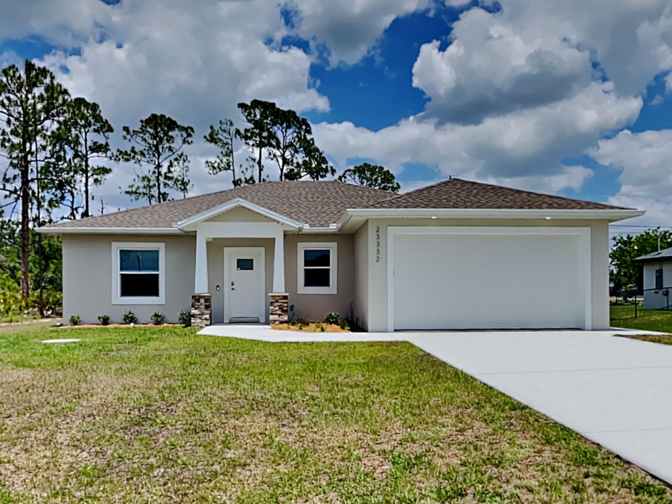 florida front of home image with white two- car garage
