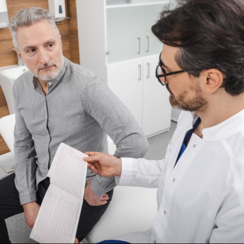 Doctor Reviews Heart Test Results with Senior Patient