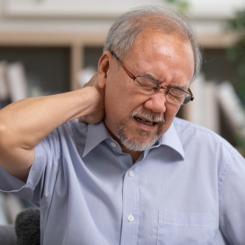 Older man suffering from shoulders and neck pain