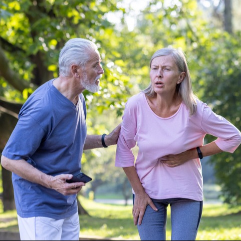 Senior Woman in Cardiac Distress While Walking