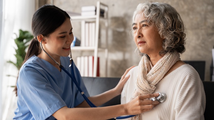 Asian young nurse supporting elderly patient 