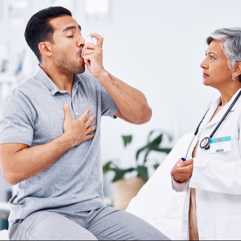 Senior Patient with Asthma Inhaler at Clinic