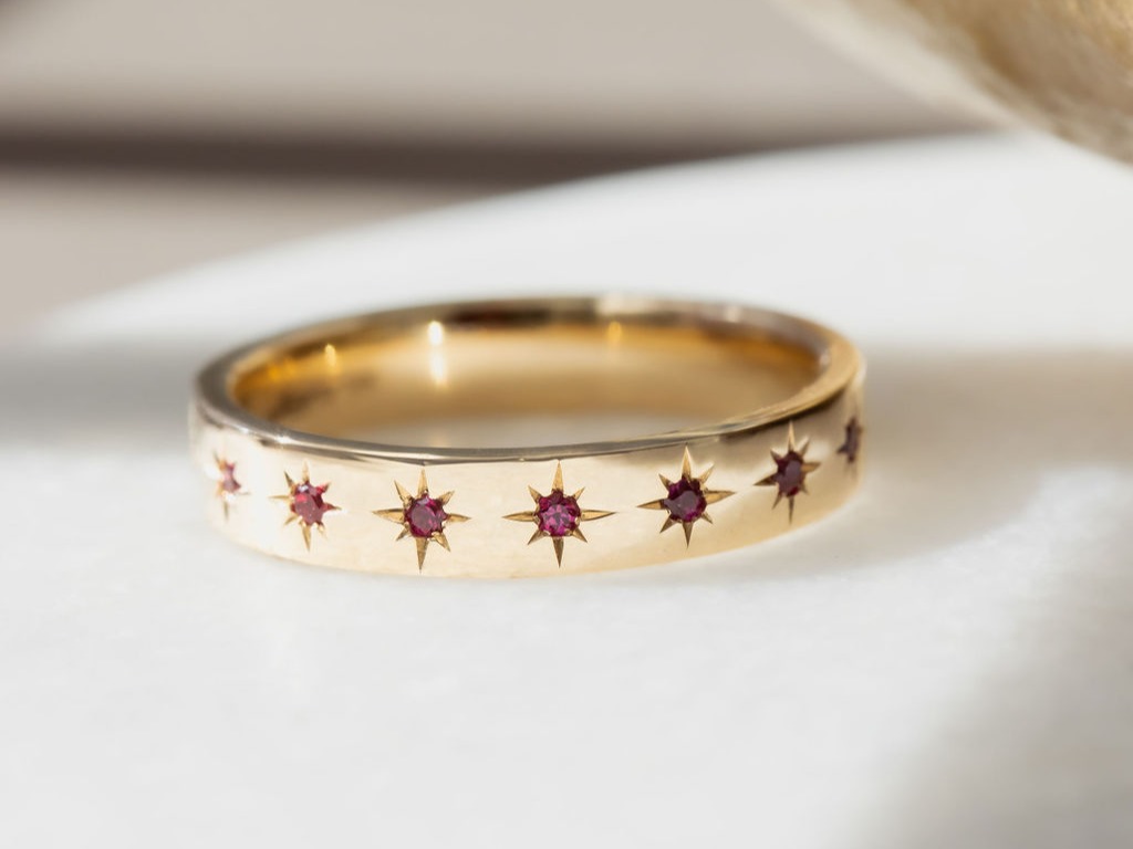 Estelle Ruby Band on a white surface.