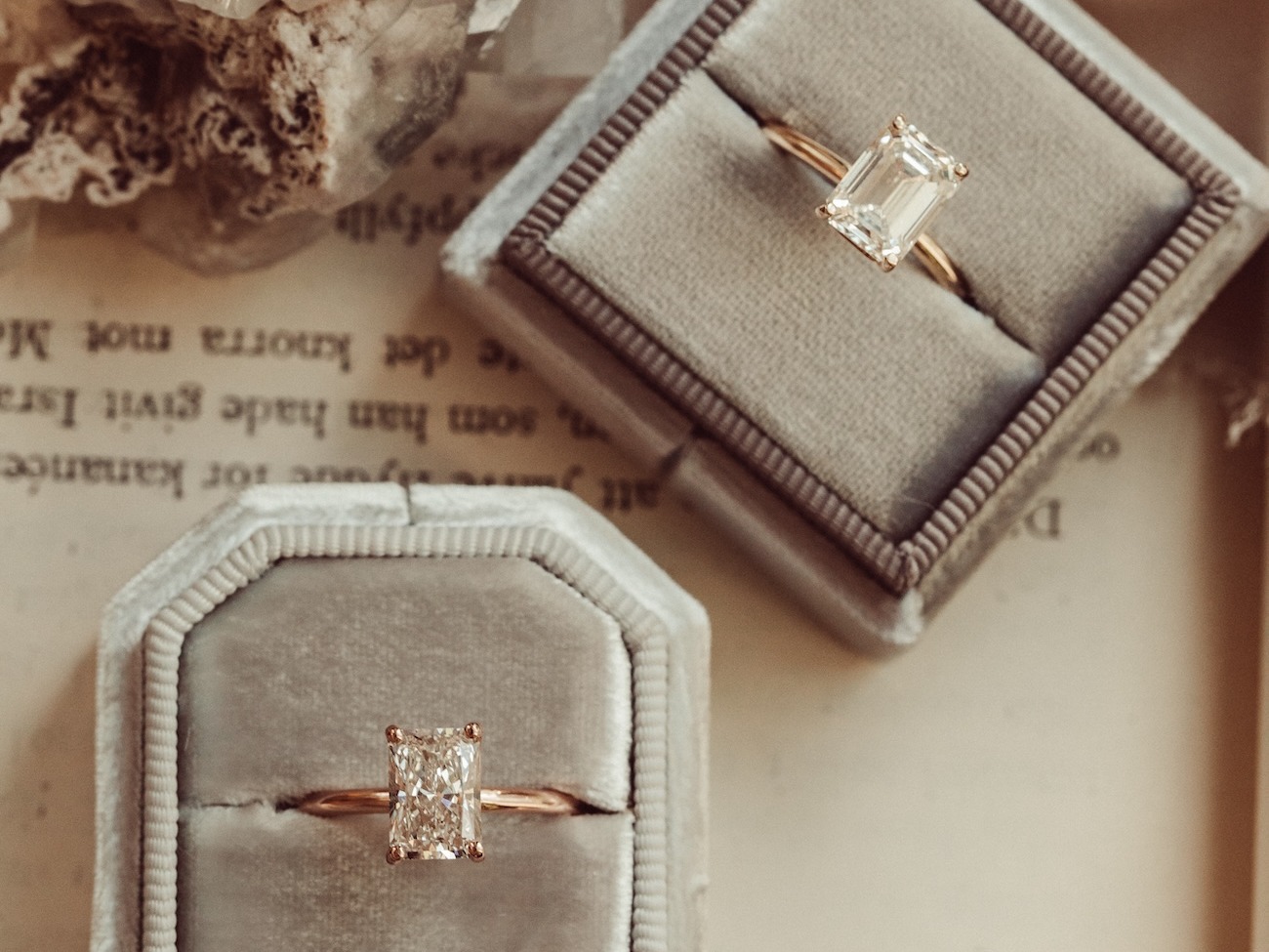 Two diamond engagement rings in a radiant and emerald cut.
